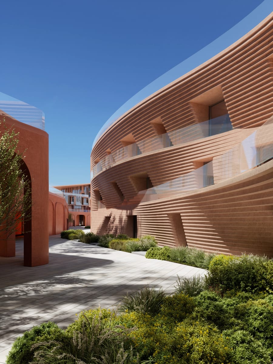 A curved residential facade above landscaped gardens