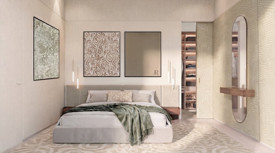A bedroom with fitted wardrobes showing the full furnishing package